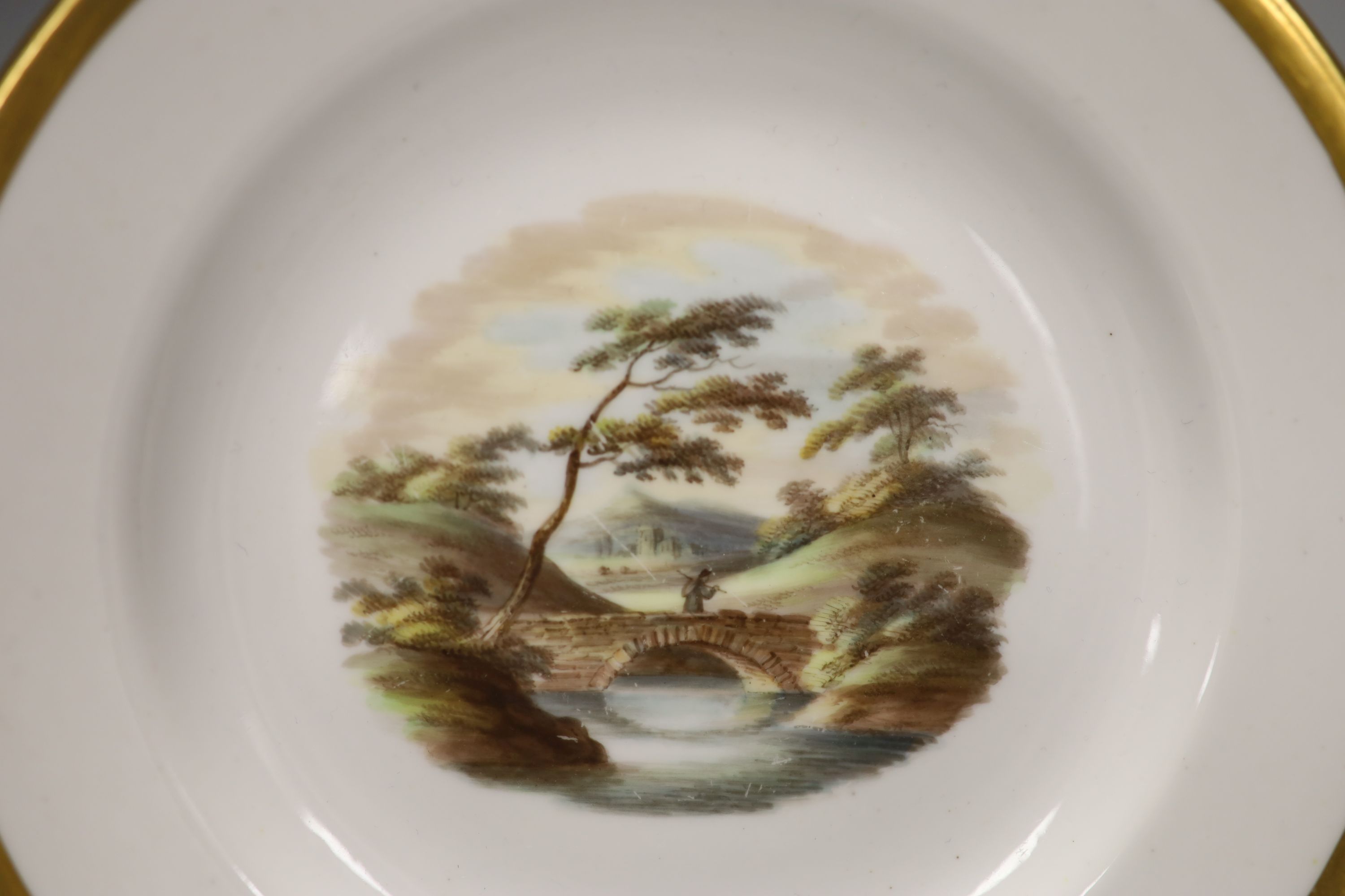 Two Spode painted plates with landscape scenes Conisbrough Castle, Bridge on River Trent, c.1820, diameter 18cm